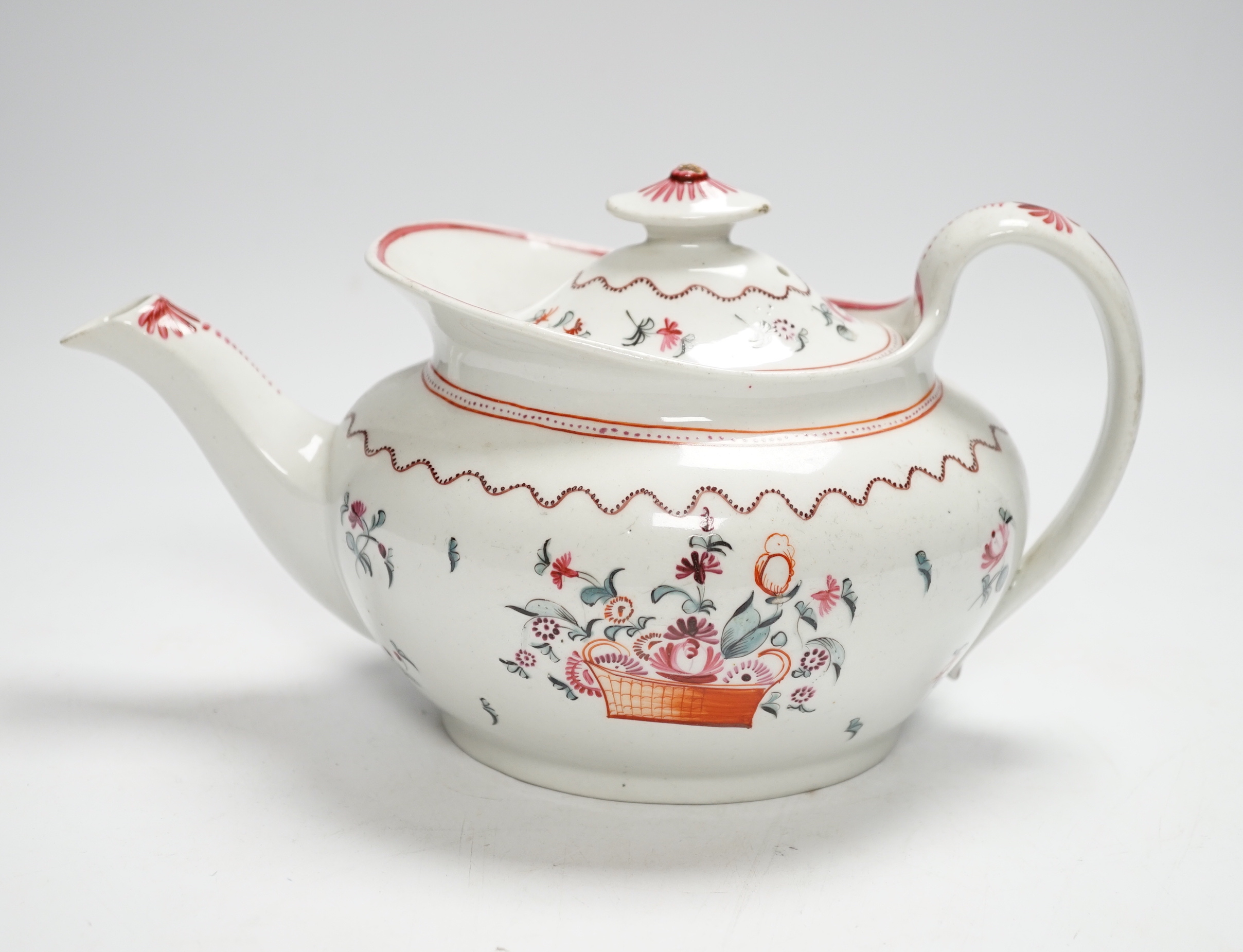 A Newhall porcelain boat shaped teapot, c.1800 with floral decoration, 25cm wide